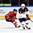 HELSINKI, FINLAND - DECEMBER 30: USA's Louis Belpedio #8 stickhandles the puck with Switzerland's Tino Kessler #22 chasing during preliminary round action at the 2016 IIHF World Junior Championship. (Photo by Matt Zambonin/HHOF-IIHF Images)

